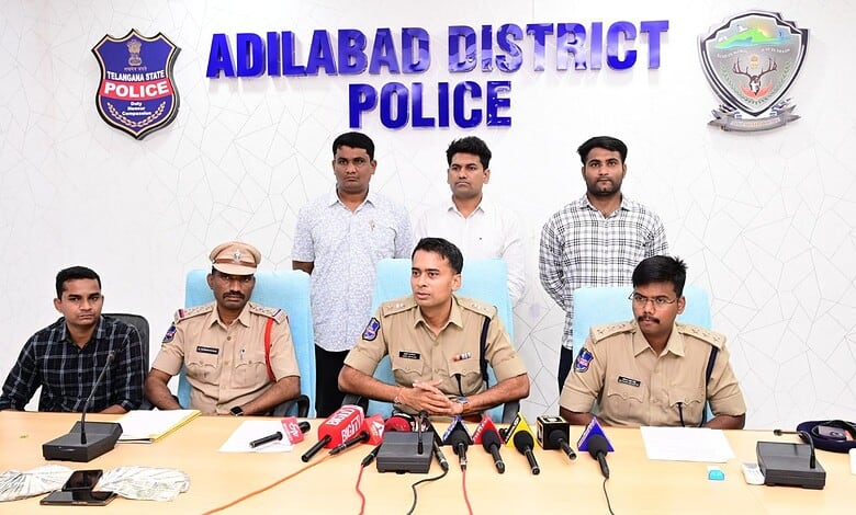 Adilabad District Police officers at a press conference on cyber fraud bust.