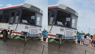 Bus accident with front damage and people inspecting the scene.