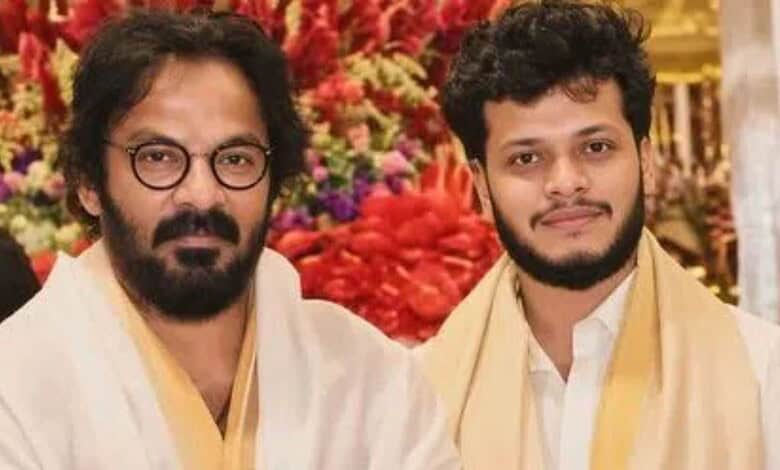 Telugu art director Anand Sai's son with his father at a celebratory event.