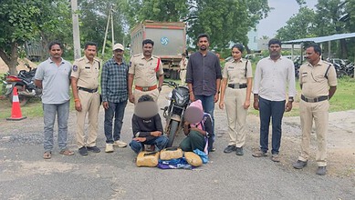 Police officers and civilians with seized items in Hyderabad, during drug bust operation.