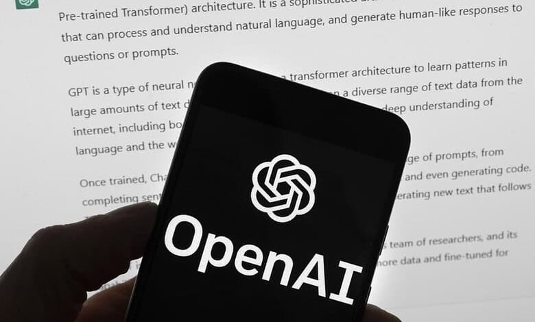 OpenAI logo displayed on a smartphone screen with a document in the background.