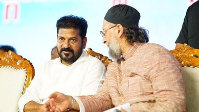 Owaisi brothers engaged in discussion at a public event in India.