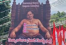Protestor dressed as 'Kumbhakarna' sitting on a throne during Telangana Congress protest.