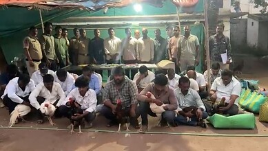Police and suspects at Hyderabad cockfight bust with seized cash and phones.