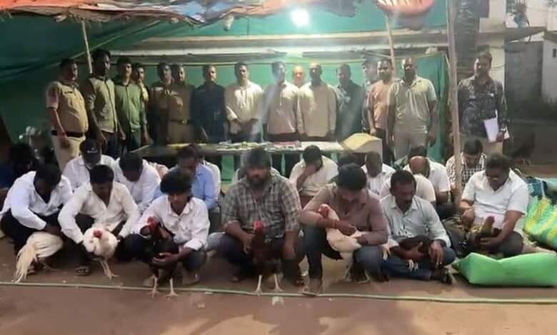 Police and suspects at Hyderabad cockfight bust with seized cash and phones.