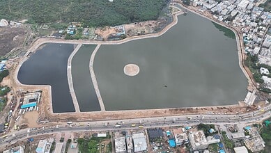 Aerial view of Nalla Cheruvu in Hyderabad with surrounding urban development.