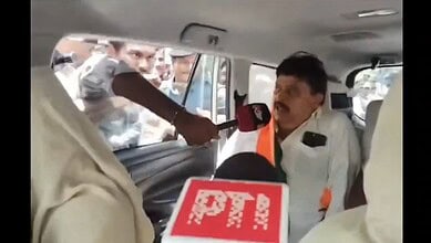 Telangana BJP chief detained during fee reimbursement protest, surrounded by media and supporters.