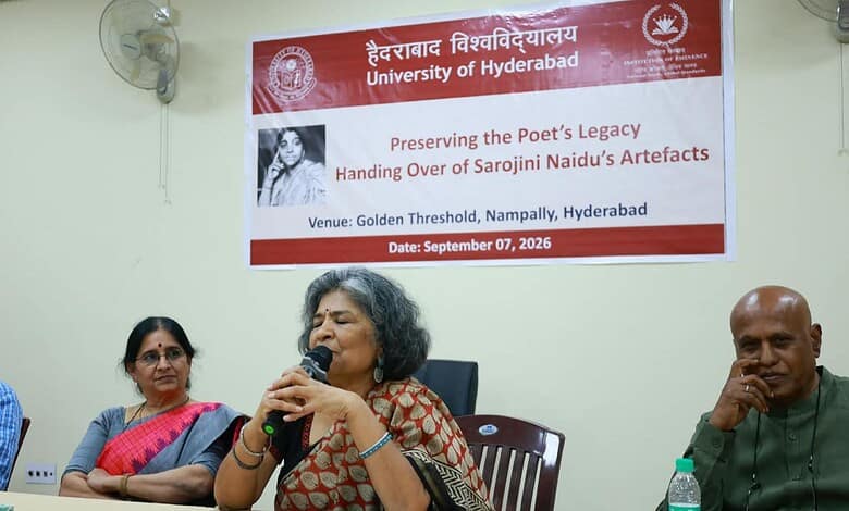 Woman speaking at a university event on preserving poet's legacy in Hyderabad.