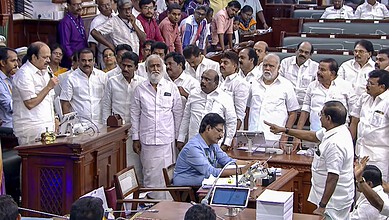 Tamil Nadu Assembly session with DMK MLAs and officials engaged in discussion.