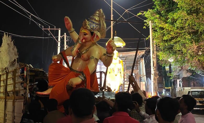 Large idol of Lord Ganesha during Ganesh Chaturthi celebration at night.