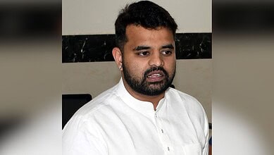 Prajwal Revanna in white kurta during police questioning at Parappana Agrahara jail.