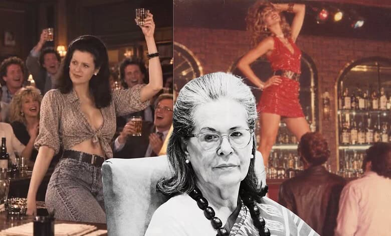 A woman with glasses and a necklace in a bar, with a dancing woman in the background.