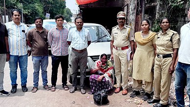Group of police officers and civilians during drug peddling arrest in Hyderabad.