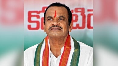 Prominent Indian politician with a red tilak and traditional attire at a public event.