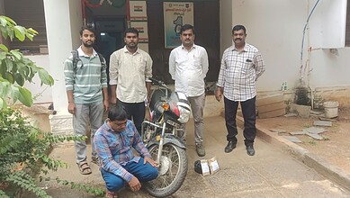 Police officers with a suspect and seized ganja in Hyderabad, India.