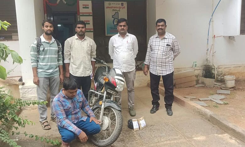Police officers with a suspect and seized ganja in Hyderabad, India.