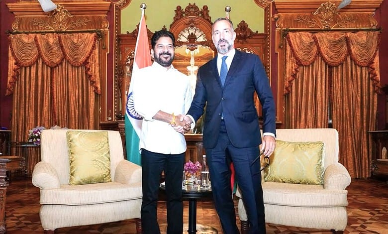 Revanth and Rahim Aga Khan shake hands during Telangana Rising Global Summit meeting.