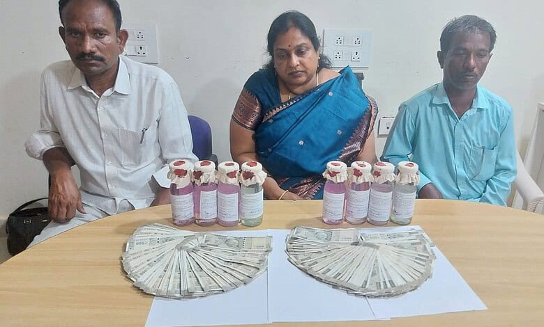 Three individuals seated at a table with bottles of medicine and stacks of cash.
