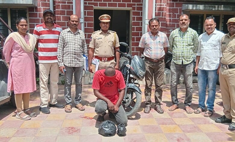 Police and officials with seized ganja and suspect in Hyderabad, drug peddling case.The Dhoolpet Excise officials with accused Akash Singh