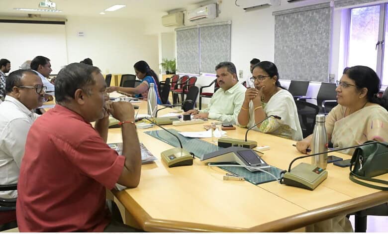 Officials discuss complaints during a meeting at GHMC and CMC offices.