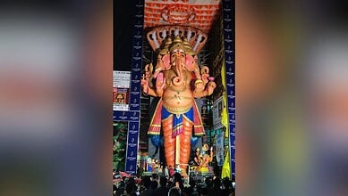 Large Ganesh idol decorated for Ganesh immersion festival in Hyderabad.
