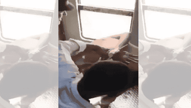 Young man on train being forced to chant 'Jai Shri Ram' by others.