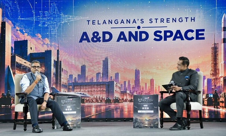 Telangana's strength highlighted at A&D and Space event with speakers on stage.