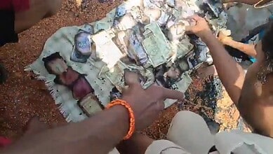 Rescue operation involving a person and a large pile of cash and gold in Vikarabad fire.