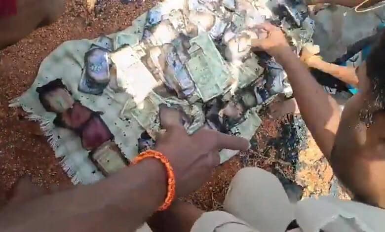 Rescue operation involving a person and a large pile of cash and gold in Vikarabad fire.