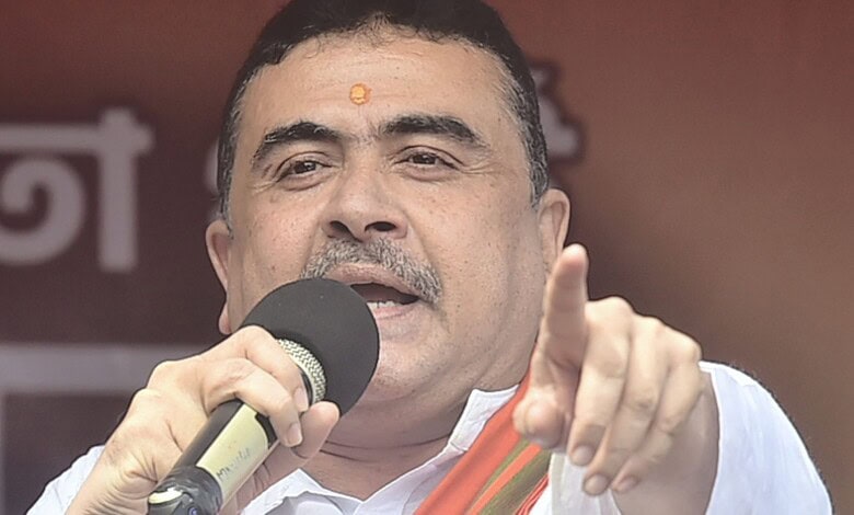 Indian politician speaking into a microphone during a public event.