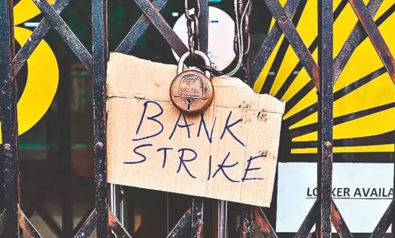 Bank strike sign hanging on a gate with a padlock, symbolising a protest or strike action.
