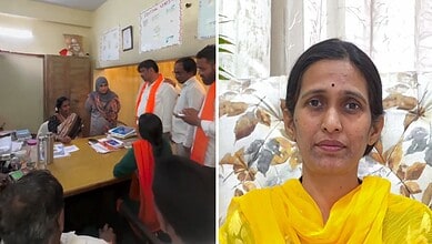 Women and men in a meeting room, some wearing orange scarves, discussing documents.