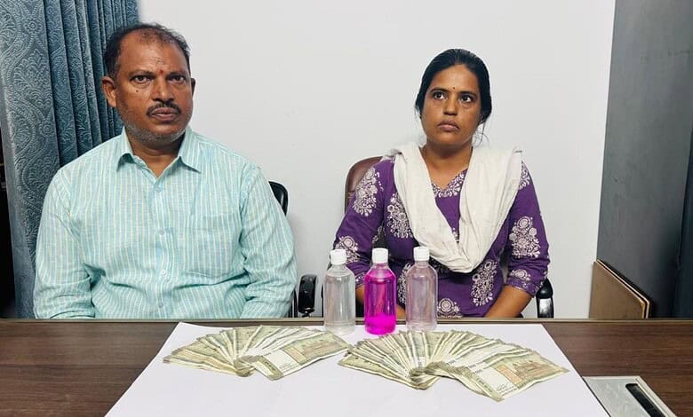 Two government officers in ACB net for accepting Rs 75K bribe, seated at a table with money and bottles.