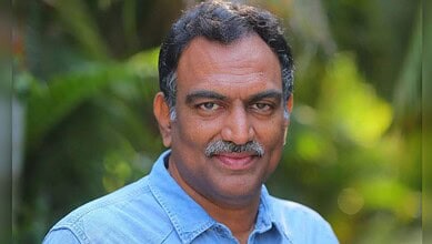 Portrait of Veeramachineni Ramakrishna with a friendly smile in a natural setting.