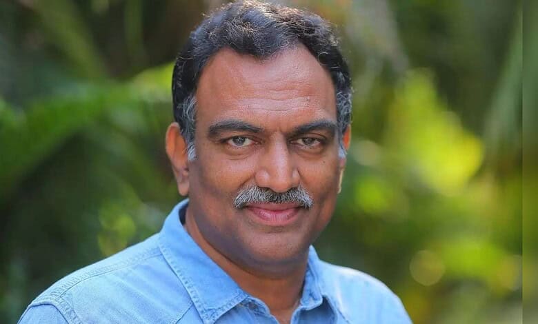 Portrait of Veeramachineni Ramakrishna with a friendly smile in a natural setting.