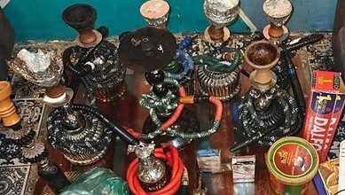 Collection of hookah pipes and accessories seized by police in Bengaluru.