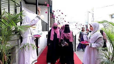 Teachers and guests celebrating Grand Teachers' Day 2026 at MS Education Academy with flower petals.