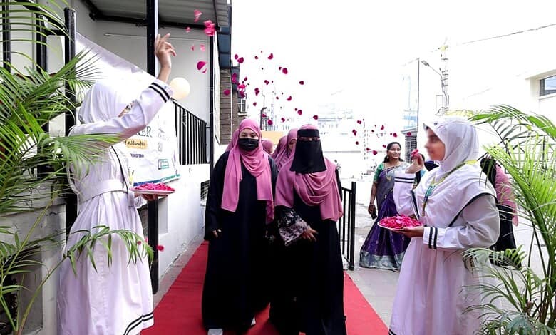 Teachers and guests celebrating Grand Teachers' Day 2026 at MS Education Academy with flower petals.
