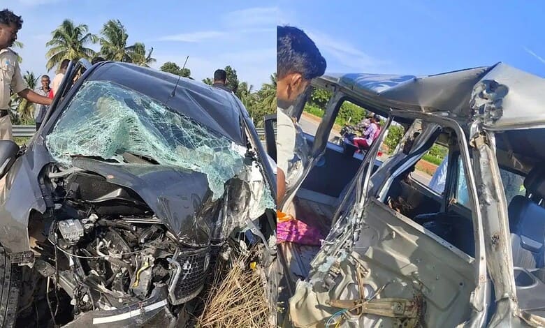 Two damaged vehicles after a collision, with police and bystanders at the scene.