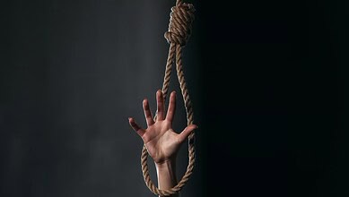 A hand holding a noose, symbolising suicide or distress.