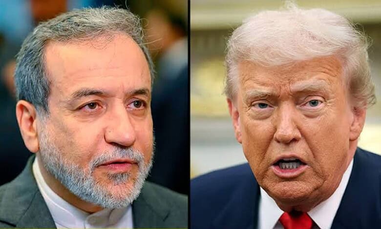 Close-up of two political figures, one with grey hair and beard, the other with blonde hair, speaking.