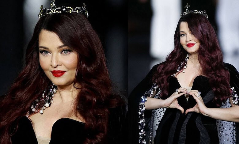 Aishwarya Rai Bachchan wearing a black gown and crown at Paris Fashion Week 2026.