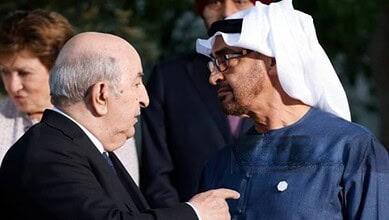 Two leaders engaged in a serious discussion during a diplomatic event.