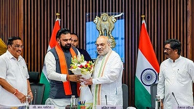 Union Home Minister Amit Shah is presented a bouquet by Bihar Chief Minister Samrat Choudhary in the presence of Union Minister of Jal Shakti CR Paatil, left, and Jharkhand Chief Minister Hemant Soren, right, during a meeting, in New Delhi.