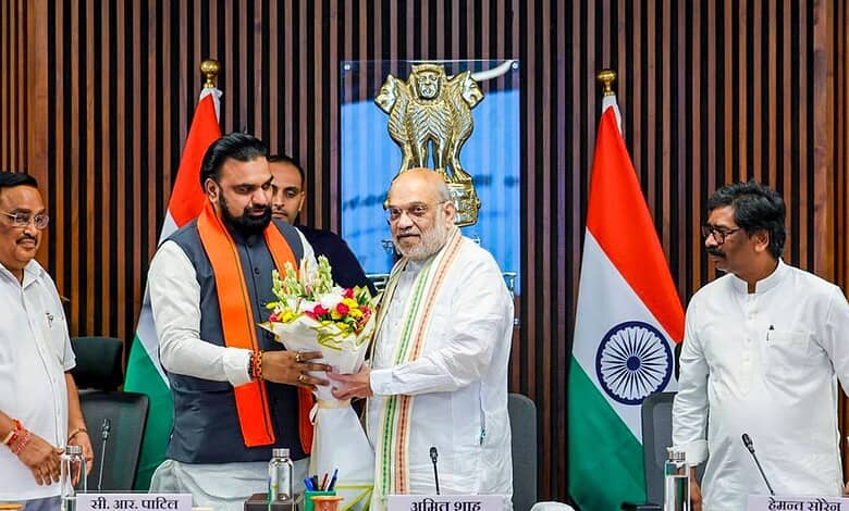 Union Home Minister Amit Shah is presented a bouquet by Bihar Chief Minister Samrat Choudhary in the presence of Union Minister of Jal Shakti CR Paatil, left, and Jharkhand Chief Minister Hemant Soren, right, during a meeting, in New Delhi.