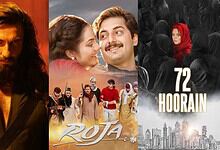 Promotional poster for Bollywood film 'Roja' featuring a romantic scene and a group of characters.