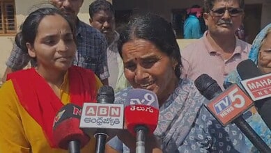 A woman cries afte being duped in the chit fund scam