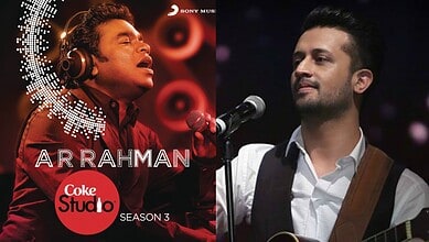 Atif Aslam performing on Coke Studio with a microphone and guitar, in a professional music setting.