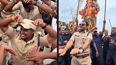 Hyderabad police officers dancing and celebrating during Ganesh immersion festival with a large crowd and.