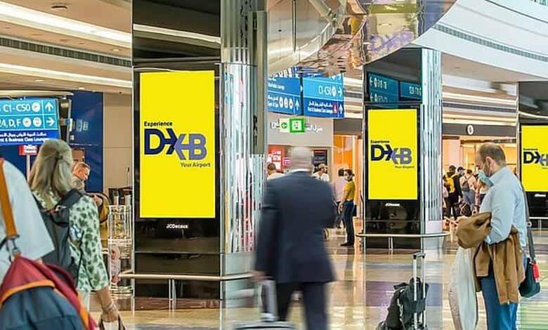 Digital signage at Dubai airport showing duty suspension extension details.
